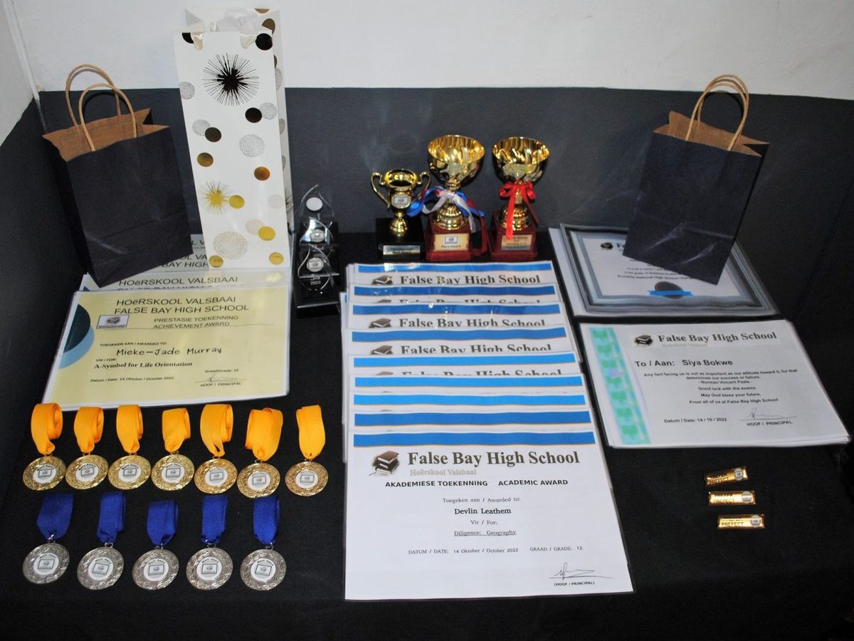 Trophies, medals and certificates on prize-giving day at False Bay High School